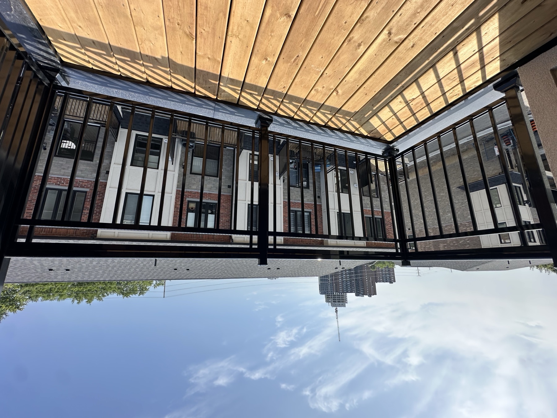 Wood-decked balcony overlooking the townhome community